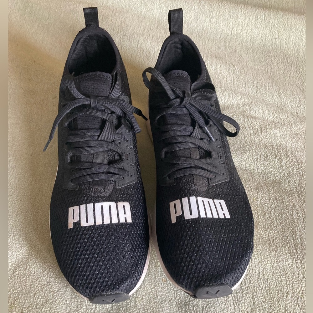 Black and white Puma shoes